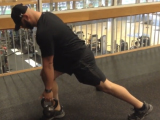 trainer working out with kettle bell