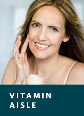 Woman applying anti-aging cream to face