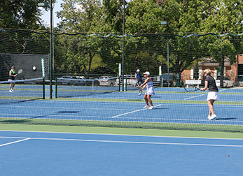 Members playing tennis