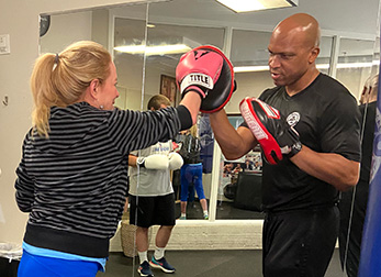 Female member in Cooper Quest Intro to Boxing Class