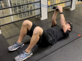 trainer doing core anti rotation exercise