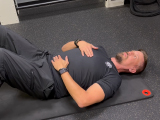 personal trainer demonstrating breathing techniques