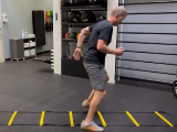 personal trainer showing agility ladder exercises