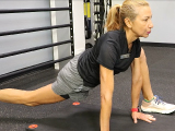 Trainer performing exercise moves
